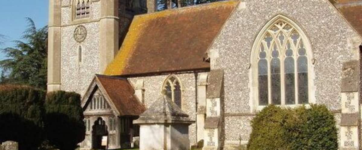 Hambleden Church with snowdrops, near to Hambleden, Buckinghamshire, Great Britain. In the middle of February snowdrops are out, daffodils in the foreground are about to flower.