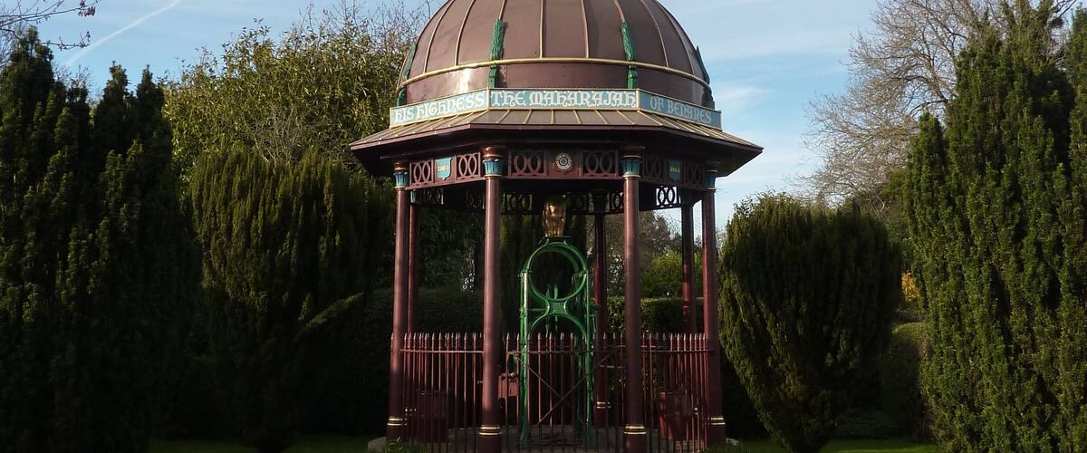 A gazebo with a dome roof and a sign reading "DISGRACED THE ORIENTAL OF DEATHS".