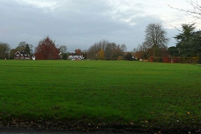 Peppard Common From the south, this is the triangular green that makes up the eastern part of Peppard Common nearest the village of Rotherfield Peppard. The B481 cuts across from the left in front of the buildings on the horizon. The white one is one of two pubs.