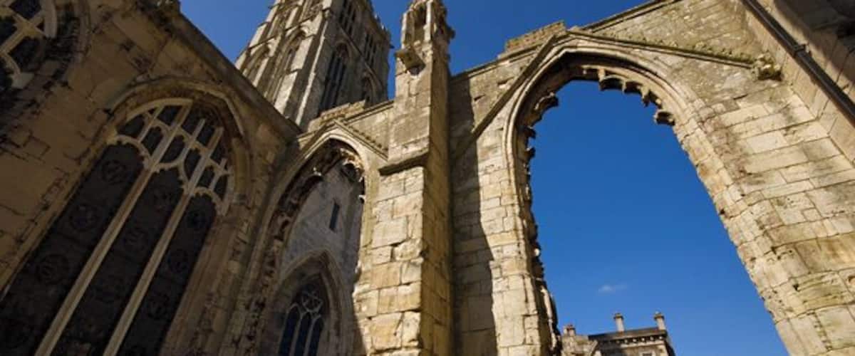 A Gothic-style cathedral with arched windows and a tall tower.