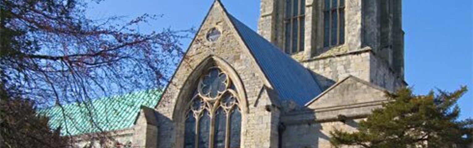 Howden Minster tower, Howden, East Riding of Yorkshire, England Seen from the churchyard to the south. Scaffolding can be seen to the left of the picture for the restoration work on the south side of the church.