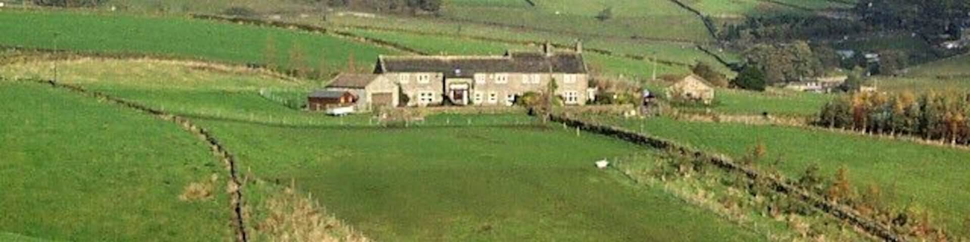 Lower Laithe, near Newsholme. Grade II listed house, seventeenth century with nineteenth century alterations. Seen looking northwards from Slack Lane.