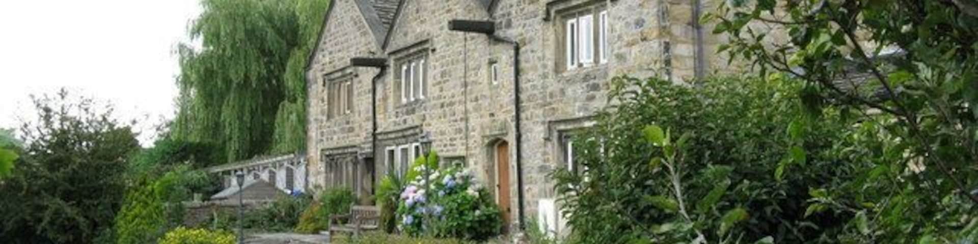 Glusburn: Old Hall Farm Very well shielded from the main road by thick trees, this superb building can only be photographed, with difficulty, from the path along the side.