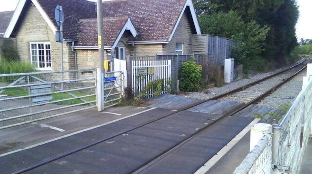 User-worked railway level crossing in Mill Street, Islip, Oxfordshire. This view is in the direction of Islip railway station. The cottage was originally for the crossing keeper.