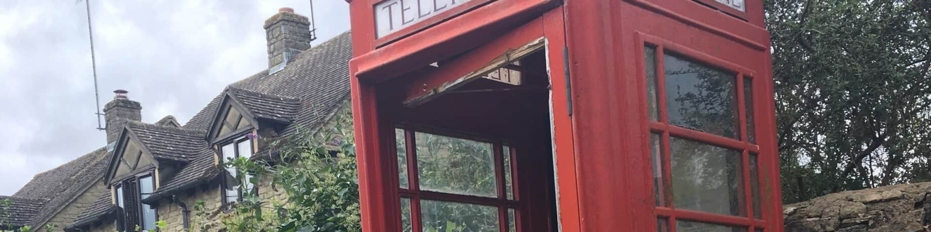 Abandoned telephone booth along the pathways in the middle of the Cotswolds
