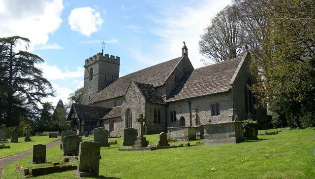 A church with a tower and a graveyard.