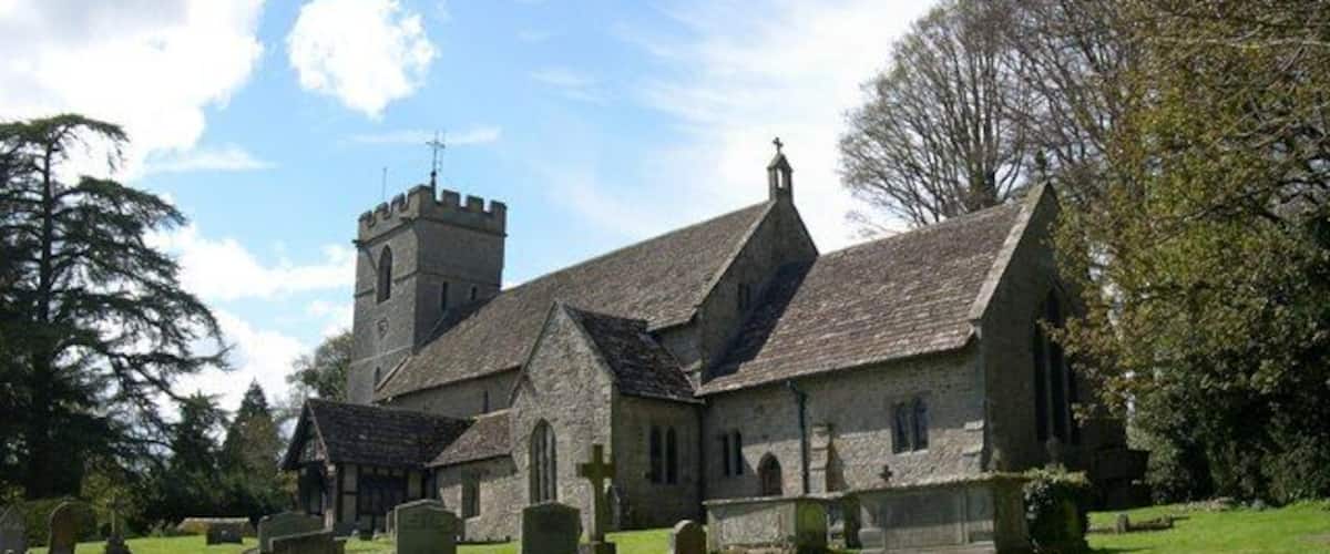 A church with a tower and a graveyard.