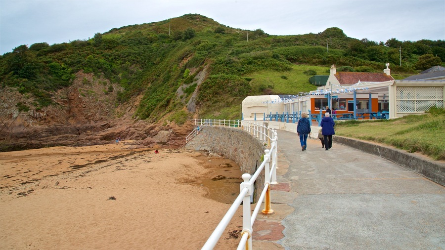 La Greve de Lecq featuring general coastal views and a beach as well as a couple