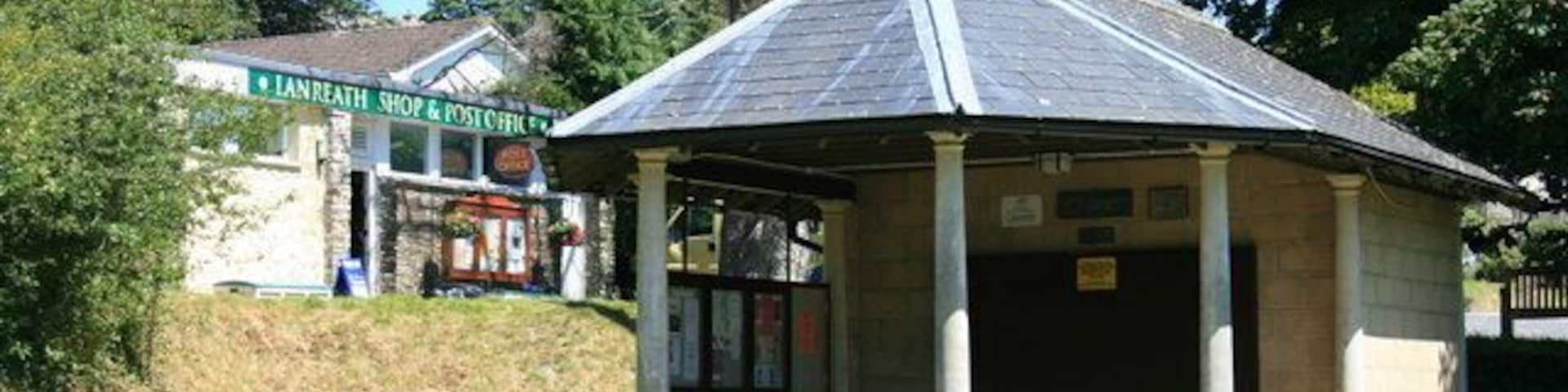 Millennium Shelter in Lanreath This shelter, with its clock and village noticeboard, was built to commemorate the Millennium in 2000. It forms a pleasant green central to the village, with the Post Office and Village Shop behind alongside the church carpark.