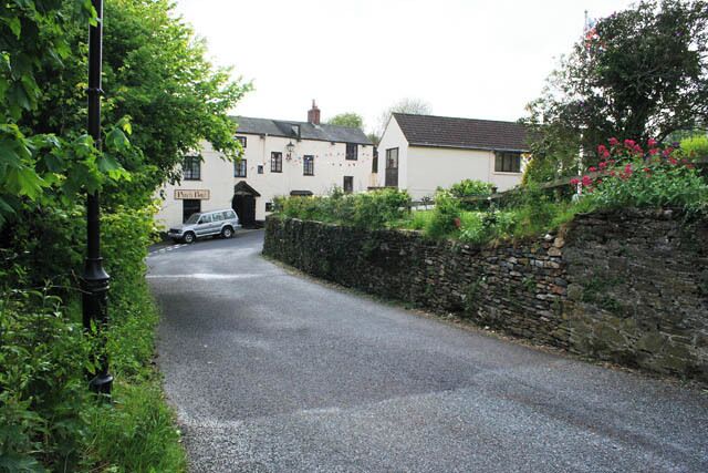 The Punch Bowl Inn, Lanreath The oldest part of the premises dates from the 13th century but the main part of the inn is 15th century. There are thick walls, flagstone floors, beams and medieval panelling. Cornwall is famous for its myths and legends, each town and village laying claim to at least one fantastic story and Lanreath is no exception. Here we have the tale of a wild black cockerel believed to be the angry soul of an old rector of the parish. One night his guest for dinner was the new young curate who had unfortunately fallen in love with the rector's young and beautiful wife. On his way to the cellar to get another bottle of wine the rector fell to his death down the stairs. Did he fall or was he pushed? We'll never know, but the next day a large black cockerel suddenly appeared and began attacking everyone in sight. At last the angry bird flew in through the window of The Punch Bowl Inn and straight into the clome oven. The quick thinking kitchen maid shut him inside and a mason was called to cement it up for ever.
