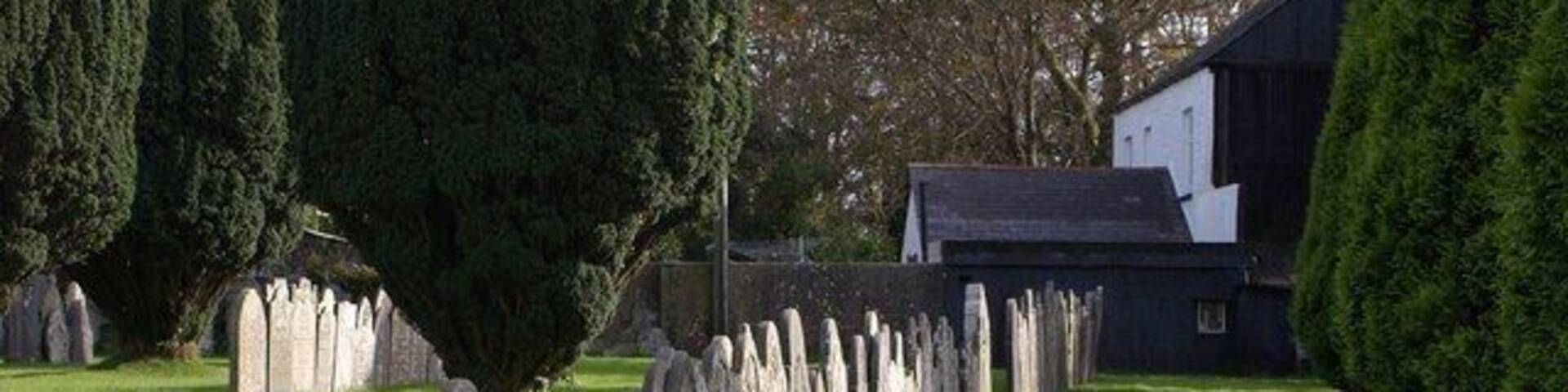 Gravestones, Coad's Green A line of stones across the churchyard of Coads Green Methodist Church.