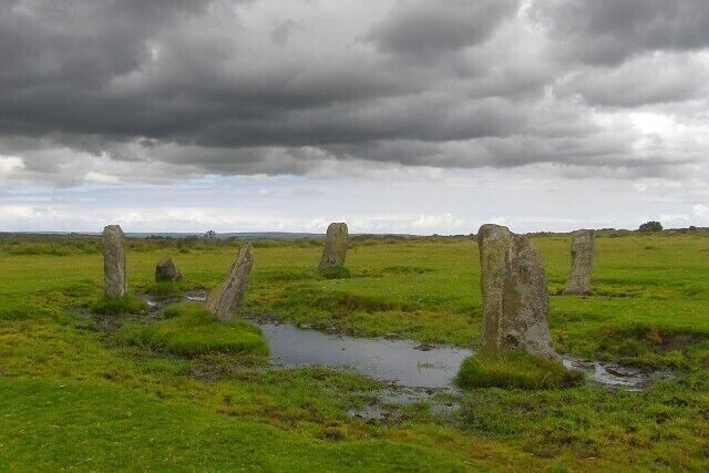 Nine Stones stone circle, East Moor Sometimes called the Nine Stones of Altarnun, although they are far from any settlement, out on the open moor. The surrounding grass shows that the area is heavily grazed, and the deep muddy puddles around the stones were made by the hooves of large herbivores who use the stones as scratching posts - there are few trees out here that could be used in that way.