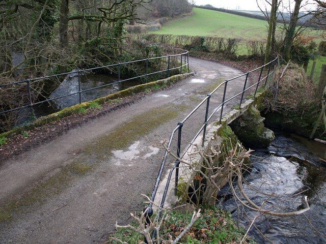 Bridge near Polyphant The lane from Polyphant to Trevell crosses Penpont Water, which is flowing to the left, before climbing the hill in the background.