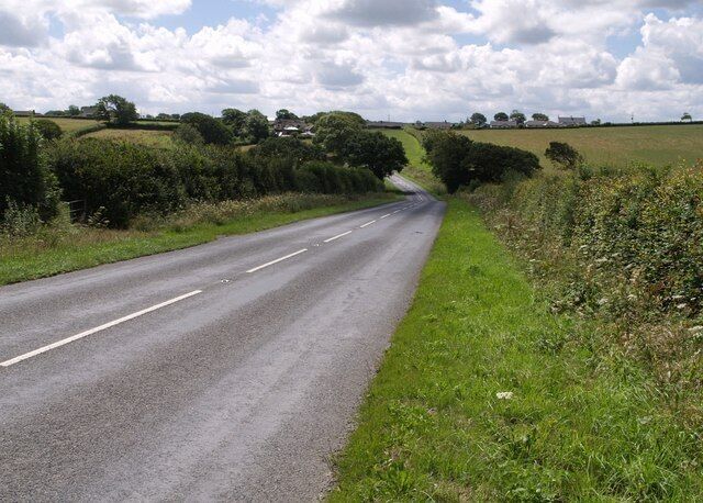 B3254 near Langdon Cross The B road dips to cross a tributary of the Tala Water as it approaches Langdon Cross.