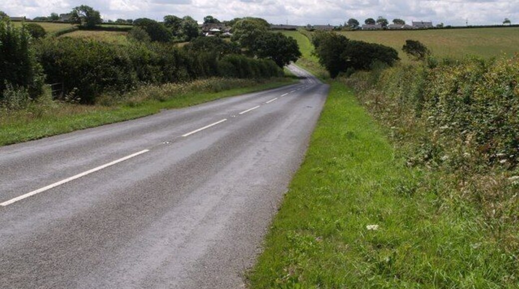 B3254 near Langdon Cross The B road dips to cross a tributary of the Tala Water as it approaches Langdon Cross.