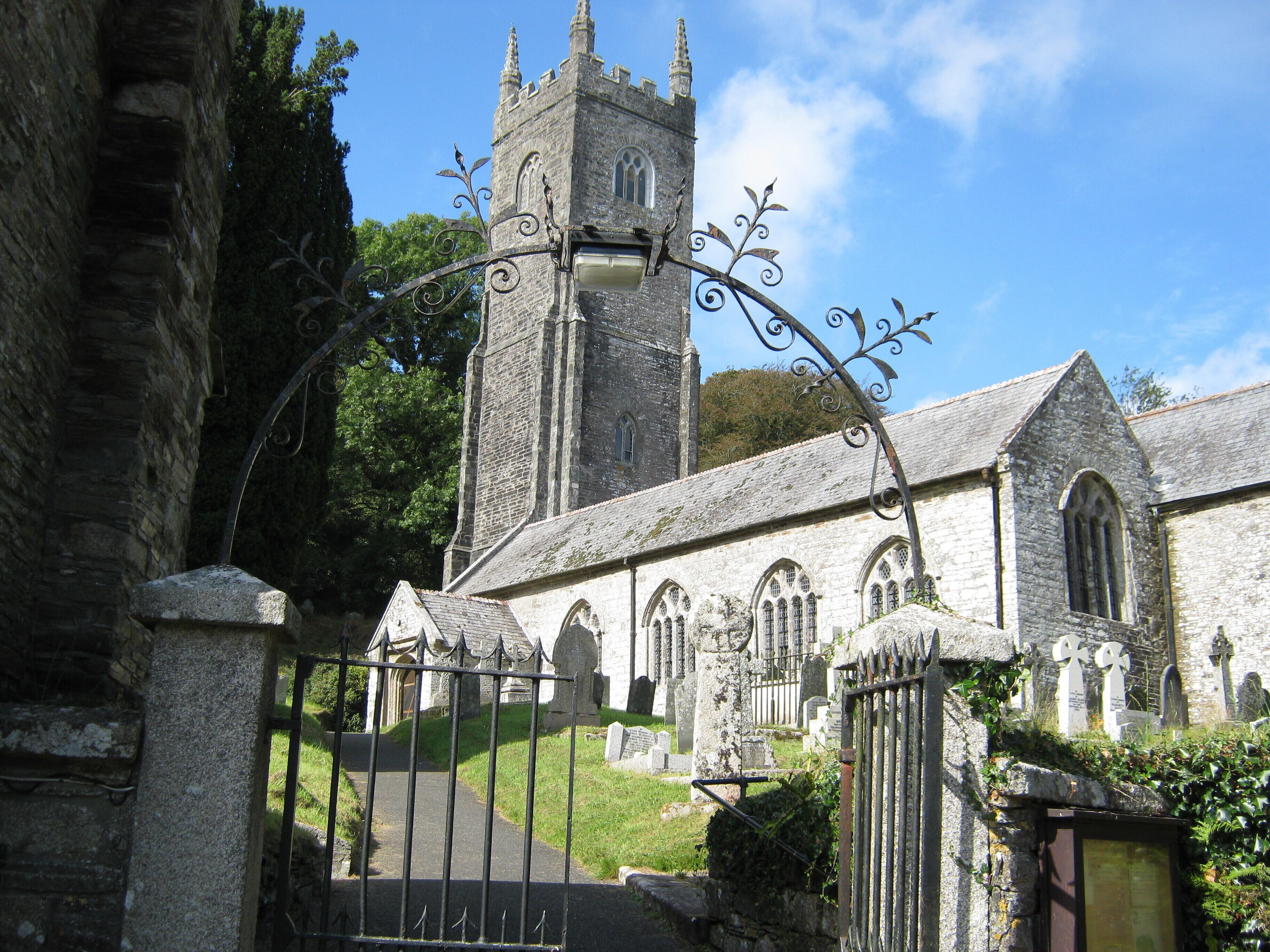 A church with a tall tower and arched windows.