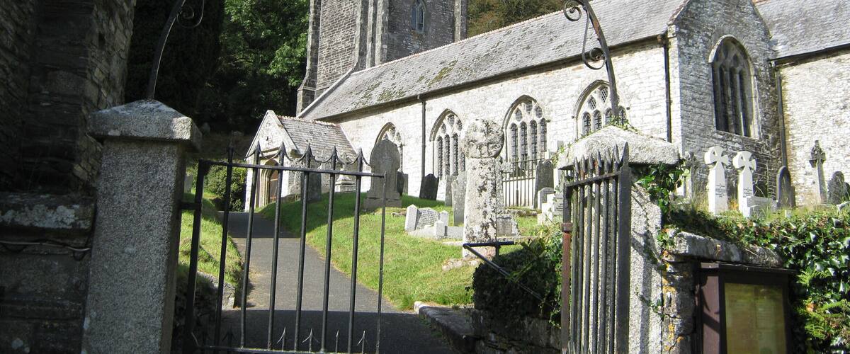 A church with a tall tower and arched windows.