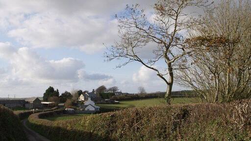 Boyton - the northern hamlet This part of Boyton lies some 400 metres away from the main part of the village around the church. On the left is Town Farm. Most of the buildings behind the white-gabled Boyton Villas are parts of the County Primary School. Taken from Underlane.