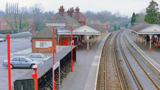 Bookham station, 1990. View westward, towards Effingham Junction and Guildford: ex-LSWR London Waterloo - Epsom - Leatherhead - Guildford line. (Cf. My almost identical view nearly 30 years before, TQ1255 : Bookham Station