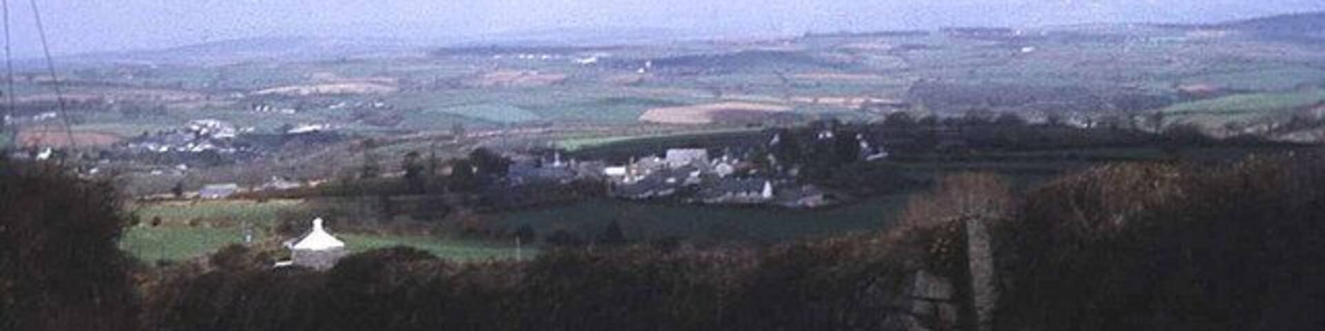 Lane to Upton Cross View eastwards as the lane descends from Minions. Upton Cross village is just below and Rilla Mill village is in the valley to the left. Expansive views across the Lynher valley from here.