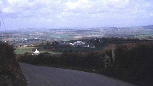 Lane to Upton Cross View eastwards as the lane descends from Minions. Upton Cross village is just below and Rilla Mill village is in the valley to the left. Expansive views across the Lynher valley from here.