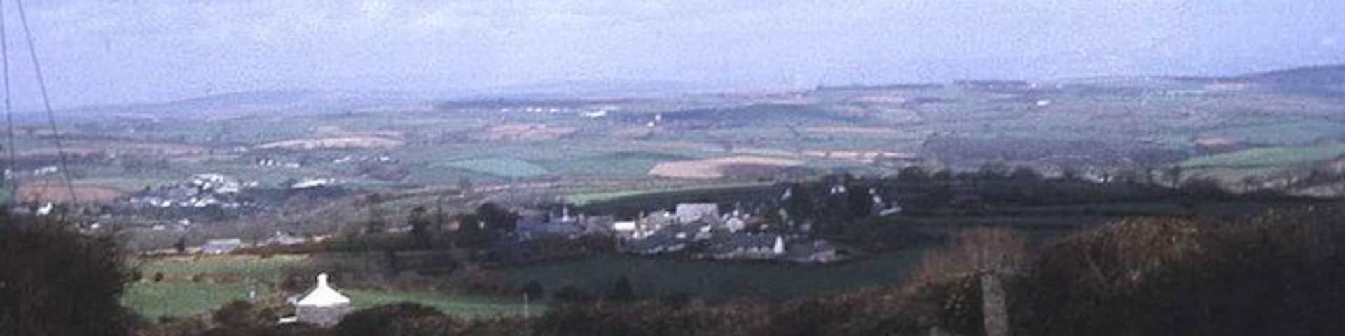 Lane to Upton Cross View eastwards as the lane descends from Minions. Upton Cross village is just below and Rilla Mill village is in the valley to the left. Expansive views across the Lynher valley from here.
