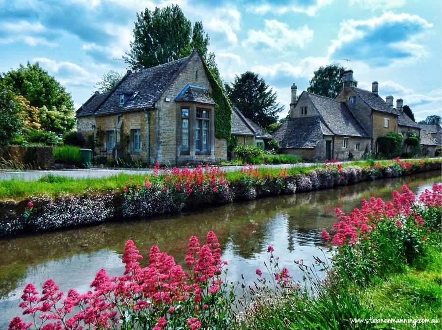 Lower Slaughter is currently my pick for most picturesque village in England that I have seen so far. It is a very small village in the county of Gloucestershire located in the Cotswold District. Through the middle of the village flows the River Eye and from the flower covered banks you can watch the trout swimming in the crystal clear water.
At one end of the village next to the river is The Old Mill which is has a working (not all the time) undershot waterwheel. There is a small museum, craft shop and tearooms which are worth a visit. It is not as busy or touristy as the nearby popular Bourton-on-the-Water this is because there is no parking for the large tour buses which I think help keep the village's charm.