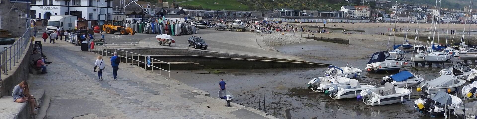 The Cobb an old stone pier forming an extensive harbour and believed to date from the time of Edward I. The origin of the name is unknown, but there are records of an ancient feast called the “Cobb Ale Feast”. With a length of 870 feet the curve of the Cobb forms a fine promenade though its upper surface slopes to the sea at an appreciable angle. Its high wall makes it a double promenade and walkers have a choice of shelter or a glorious blow.
#LikeALocal