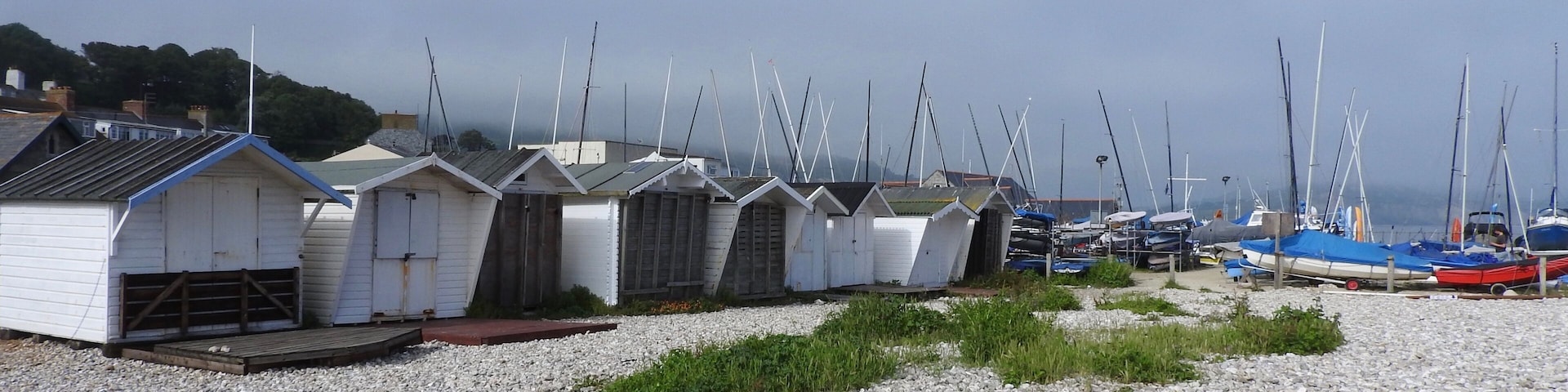 Bordering Monmouth Beach in Lyme Regis, England, are holiday chalets, beach huts, the bowling green, Lyme Regis Power Boat Club and Boat Building Academy. Here you can find a layer of limestone called the ammonite graveyard or the ammonite pavement. This layer of rock is famous for the large ammonites it contains.