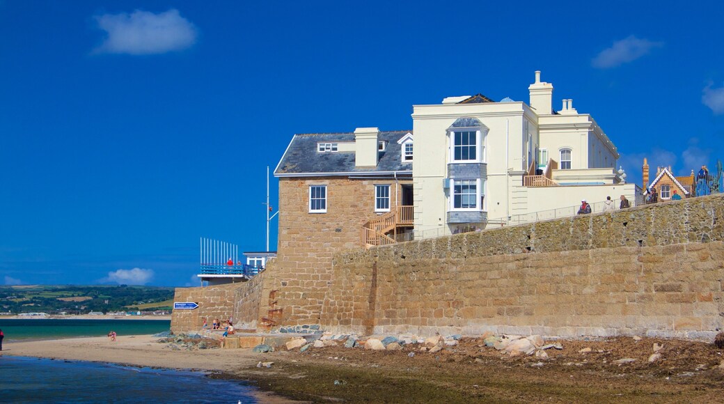 Marazion showing a sandy beach, general coastal views and a house