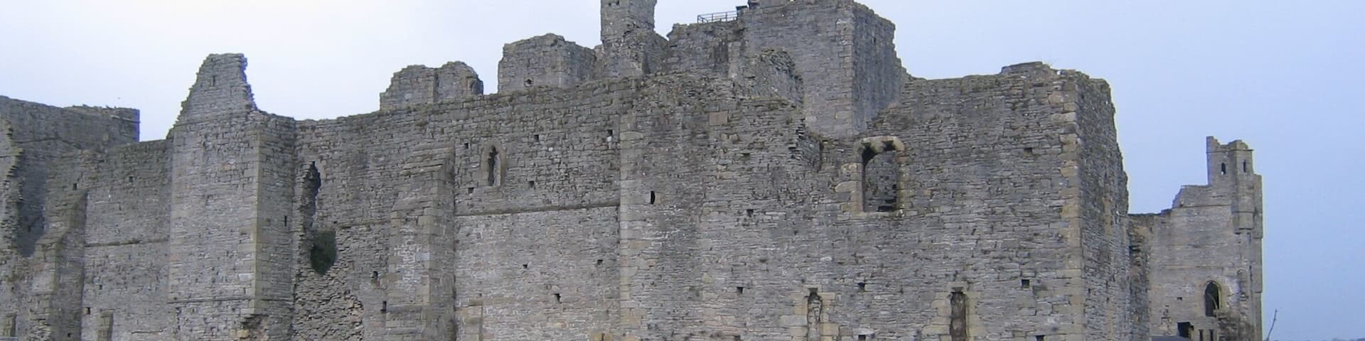 Middleham Castle This photograph shows a view of Middleham Castle from the public footpath that runs from the village due south to the River Cover. The picture was taken looking in a northerly direction towards Middleham.