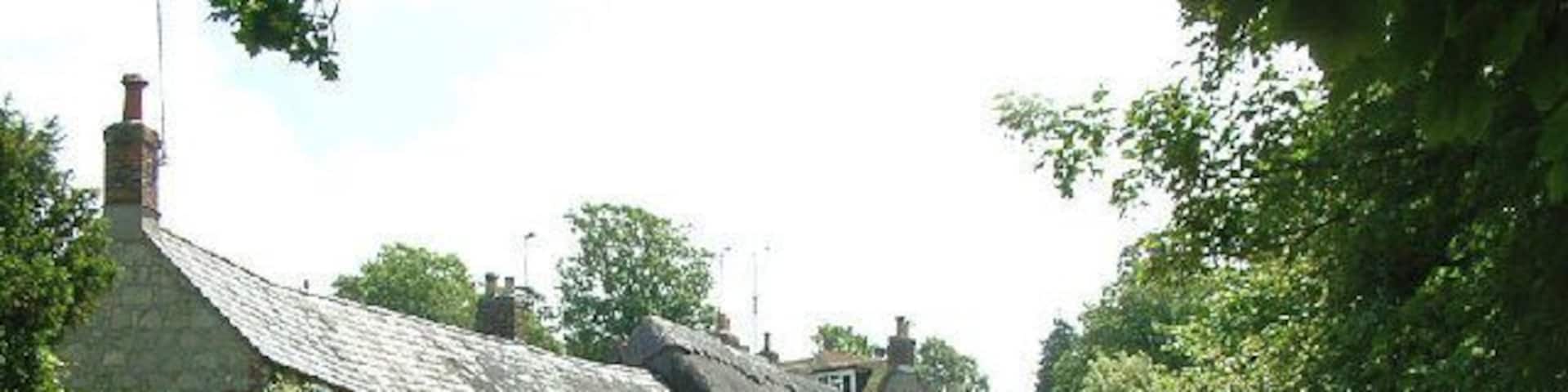 Winkle Street. The chocolate-box image of Winkle Street (also known as Barrington Row) in Calbourne, with the Caul Bourne running in front of the houses, once powering five mills