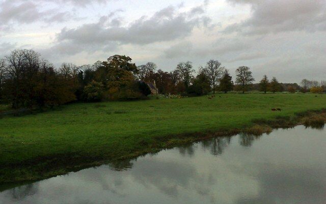 View fromTyringham Bridge St. Peter's church seen across meadows from Tyringham Bridge over the River Ouse.