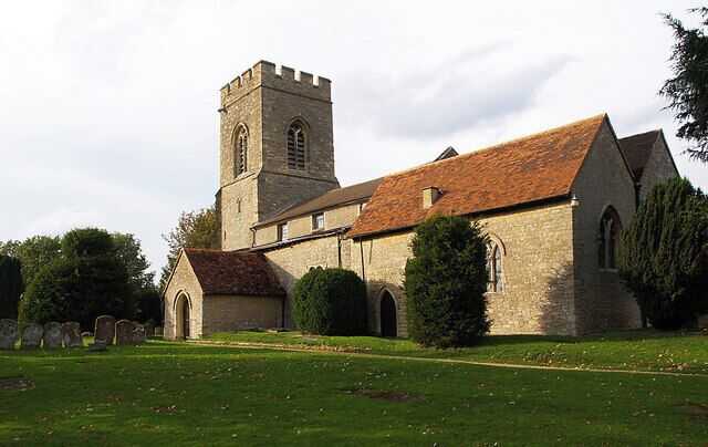 A church with a tower and arched windows.