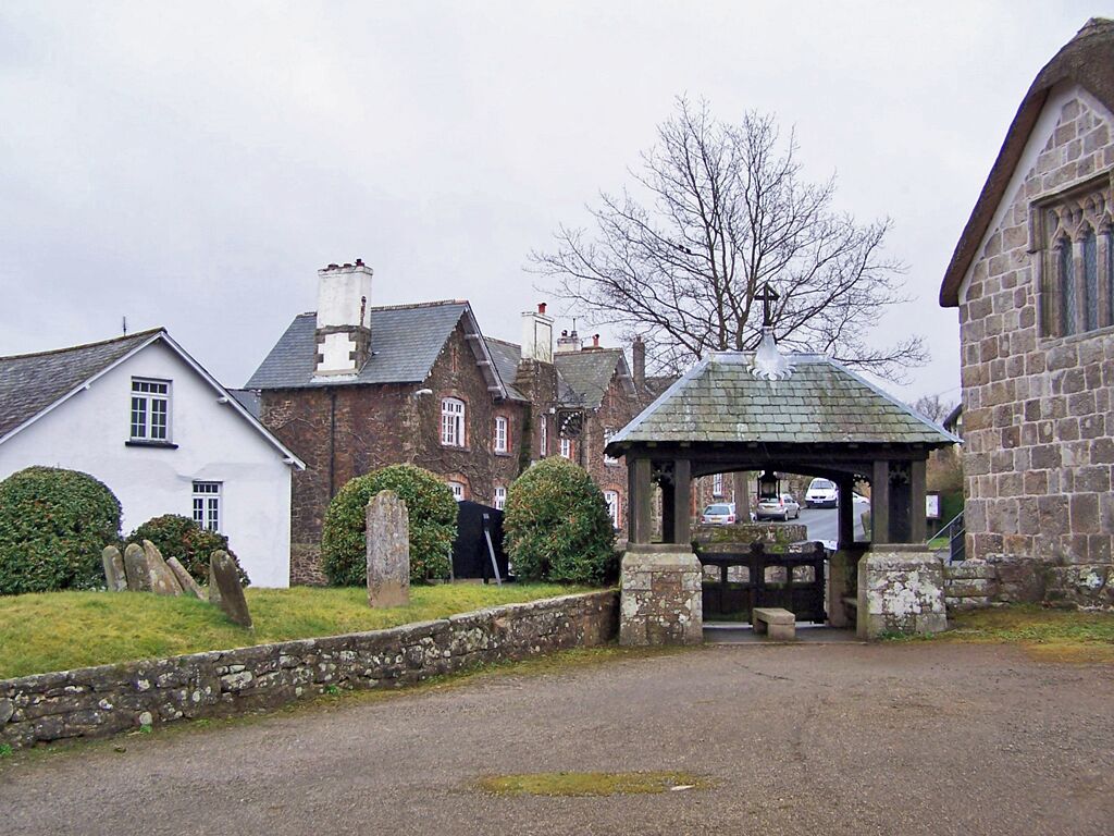 Lych gate of St. Andrew's church, South Tawton. Seen from inside the churchyard. Church House is to the right, 1772728, and the Seven Stars public house is the stone building to the left of the lych gate 1772736.