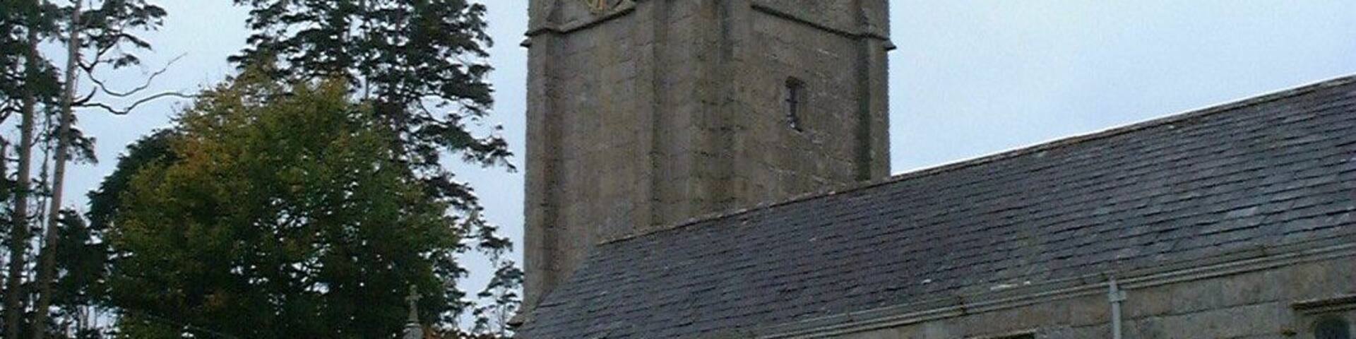 West tower and south porch of St Mary the Blesséd Virgin parish church, Exbourne, Devon, seen from the southeast