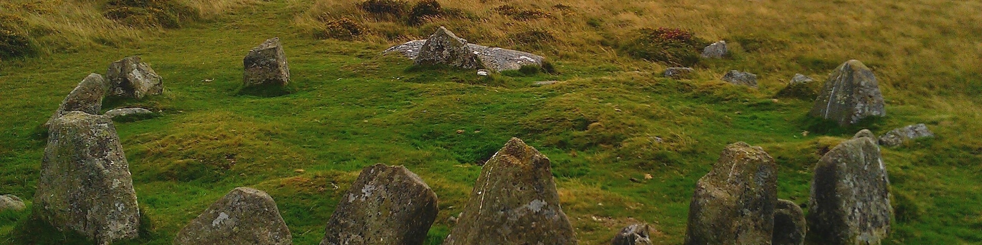 The Nine Stones circle, a ring cairn on Belstone Common near to the village of Belstone in Dartmoor, Devon. This image was taken facing a south-easterly direction, with Belstone Tor in the background.