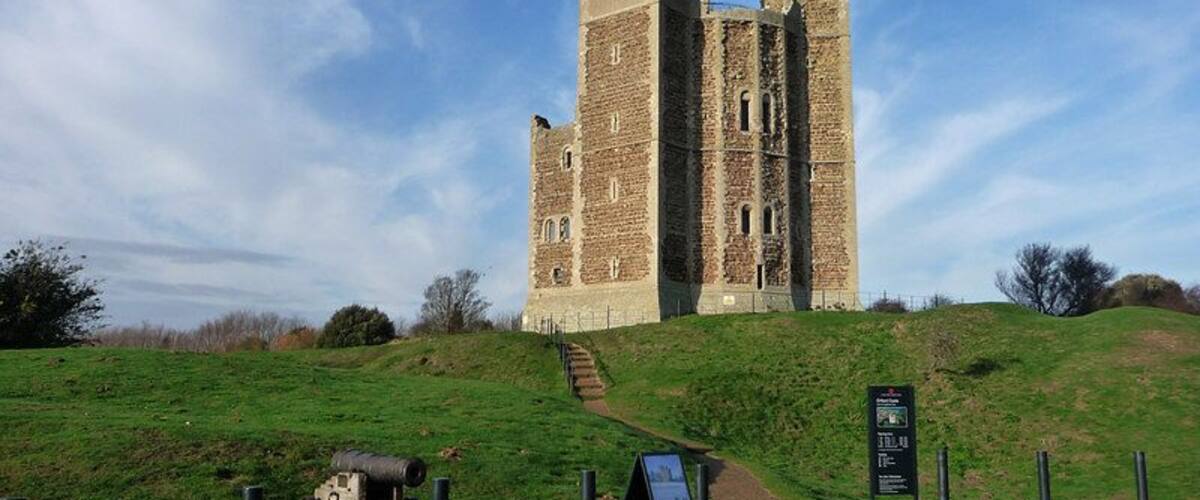 Orford Castle From English Heritage:An 18-sided drum with three square turrets, and a forebuilding reinforcing its entrance, the keep was built to a highly innovative design. The progress of its construction between 1165 and 1173 is extensively recorded in royal documents. Both exterior and interior survive almost intact,allowing visitors to explore the basement with its vital well, and the lower and upper halls - the latter the principal room of the castle. Round these polygonal rooms is a maze of passages, leading to the chapel, kitchen and other chambers in the turrets. From the roof there are magnificent views seaward to Orford Ness.