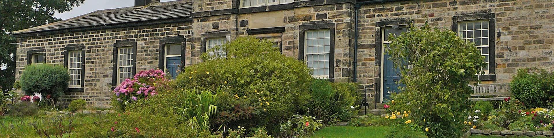 Leathley. Founded 1769 by Ann Hirsch. The part with the semicircular window was a schoolroom.
