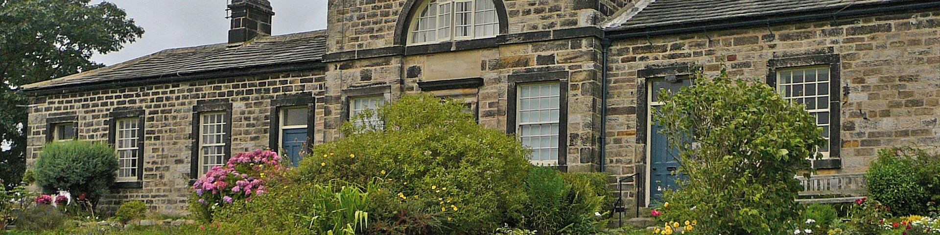 Leathley. Founded 1769 by Ann Hirsch. The part with the semicircular window was a schoolroom.