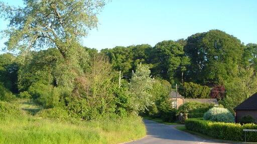 Venn Ottery. The lane junction at the tiny village, now considerable enlarged by new houses in Barton Mews (right). The lane ahead leads to Newton Poppleford.