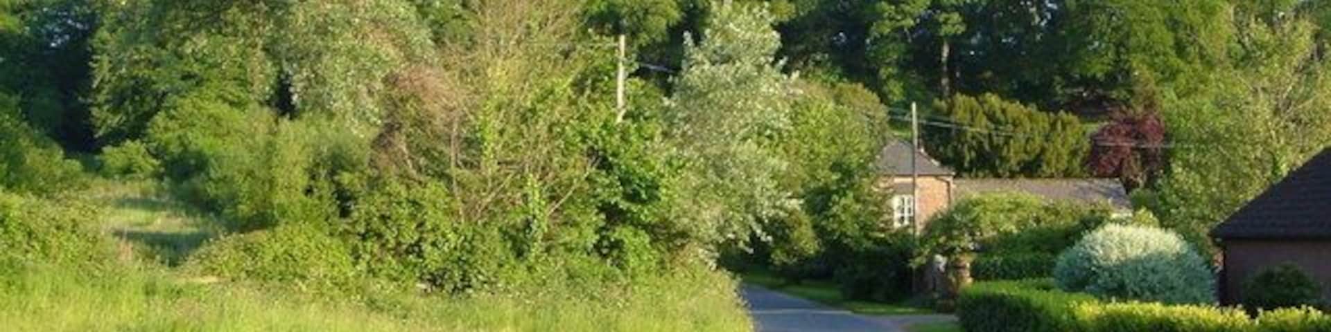 Venn Ottery. The lane junction at the tiny village, now considerable enlarged by new houses in Barton Mews (right). The lane ahead leads to Newton Poppleford.