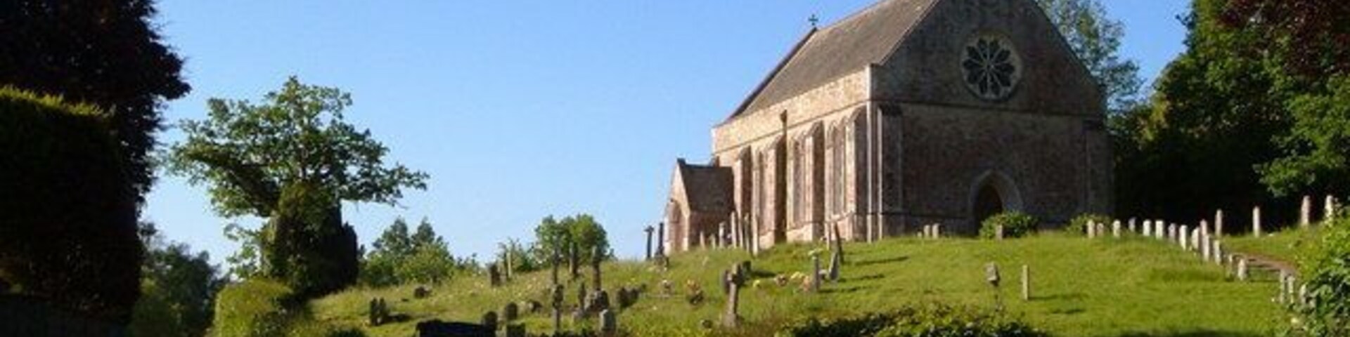 St John's church, Tipton St John. In the western part of the village, Tipton Vale, on the west side of the River Otter. The church, on its hill overlooking a narrow stretch of lane, dates from 1839-40.