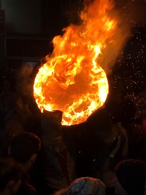 #LikeALocal. A free Entry event held every year in Ottery St Mary, East Devon. The Flaming Tar Barrels are carried through the streets of the town to the delight of thousands of townsfolk and visitors, something that has become very well known throughout the years.
Ottery St. Mary is internationally renowned for its Tar Barrels – the event is said to have originated in the 17th century, and is held each year. Each of Ottery’s central public houses sponsors a single barrel. Held on November 4th, the barrels are soaked with tar and are lit outside each of the pubs in turn and once the flames begin to pour out, they are hoisted up onto local people’s backs and shoulders.