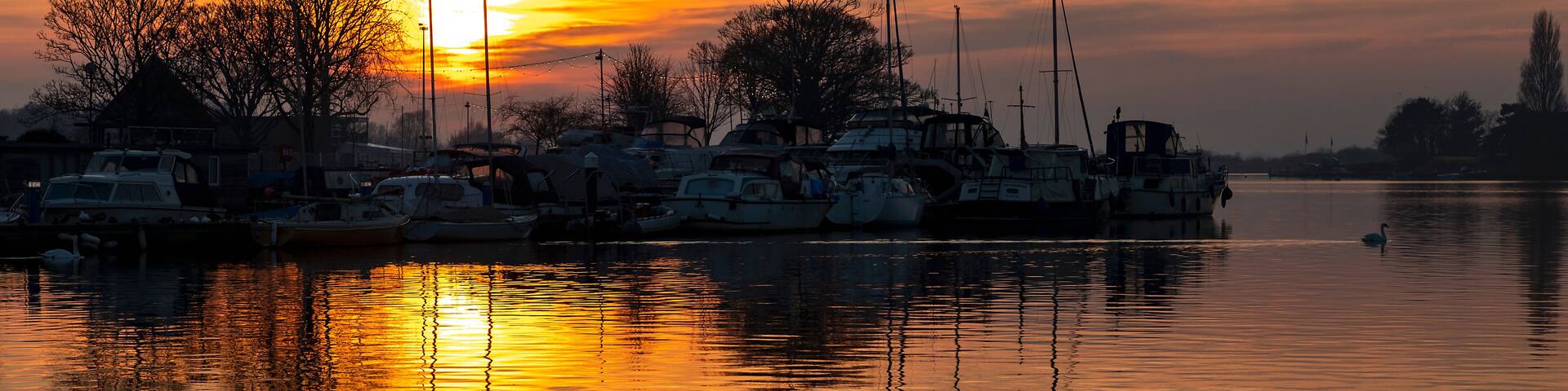 Sunset of a rural English lake.