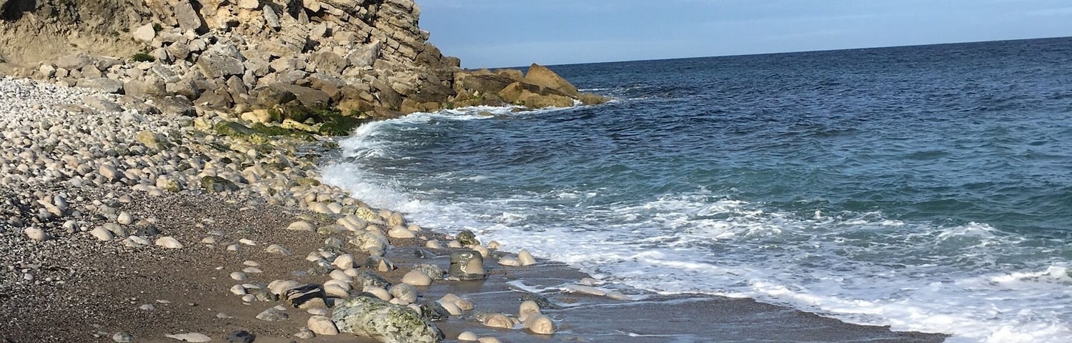 Beautiful quiet beach 
Very big pebbles, rocks so probably don't attempt to go barefoot.