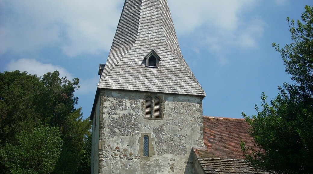 The 12th century tower of the church of St John the Evangelist in Bury, West Sussex, UK.