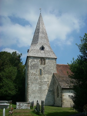 The 12th century tower of the church of St John the Evangelist in Bury, West Sussex, UK.