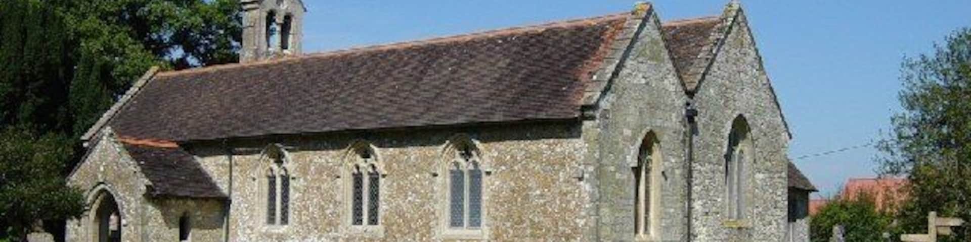 SS Peter and Paul parish church, Ashington, West Sussex, seen from the southeast. The nave is 15th-century; the south aisle was added in 1872. One of the bells was cast in 1350.