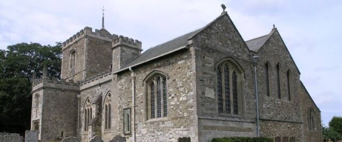 St Mary the Virgin, Bletchingley. The tower dates back to circa 1090, with the porch and oak door dating to 1460. The tower originally had a spire, but this was destroyed when it was struck by lightning in 1606. The nave is comparatively modern, being built in 1856. Just beneath the window covered with glass is a smaller round hole (partially covered by a gravestone in this picture). This was possibly used by Roger the Hermit, who is said to have visited these parts in the 13th-century.